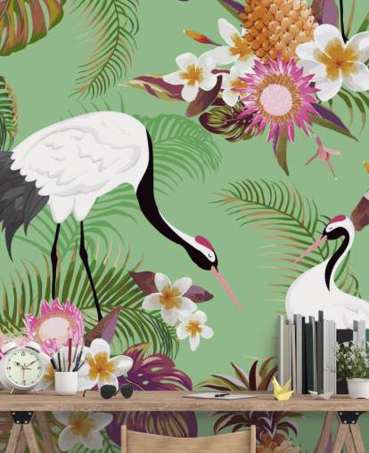 dois guindastes com folhagem tropical e papel de parede de fundo verde