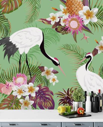 two cranes with tropical foliage and green background wallpaper