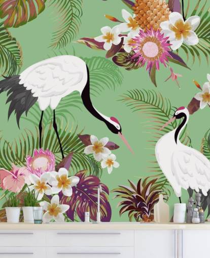 two cranes with tropical foliage and green background wallpaper