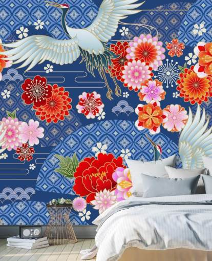 grullas y flores brillantes contra papel tapiz de paisaje azul