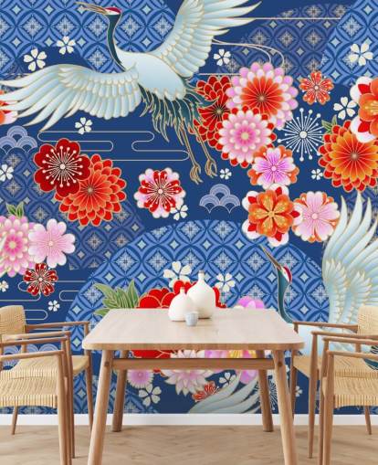 grullas y flores brillantes contra papel tapiz de paisaje azul