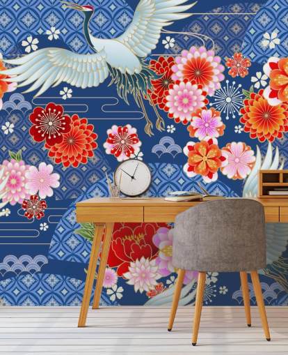 grullas y flores brillantes contra papel tapiz de paisaje azul