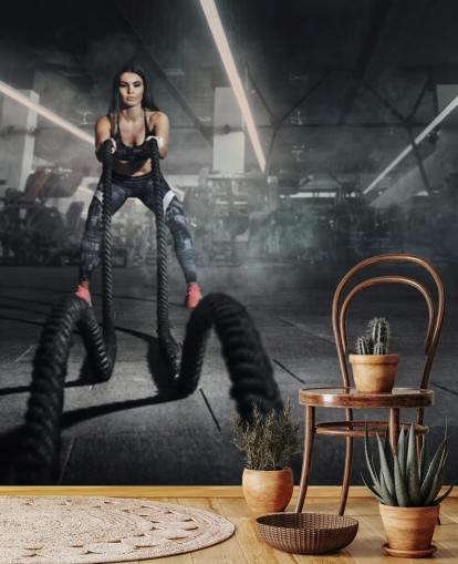 Powerful muscular woman fitness trainer do battle workout with ropes mural Powerful muscular woman fitness trainer do battle workout with ropes mural