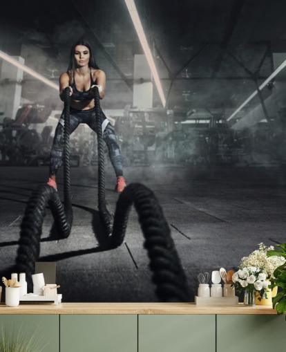 Powerful muscular woman fitness trainer do battle workout with ropes mural Powerful muscular woman fitness trainer do battle workout with ropes mural