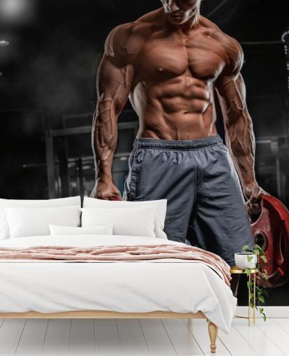 behang sterke bodybuilder man met gewichten