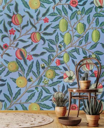 Tapete mit blauem Hintergrund, Limetten und Granatapfel