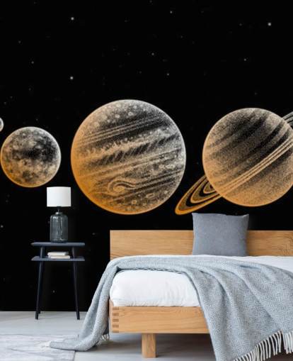 planetas en tonos dorados sobre fondo negro