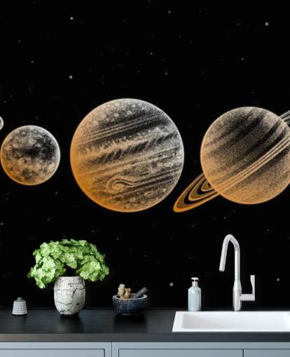 planetas en tonos dorados sobre fondo negro