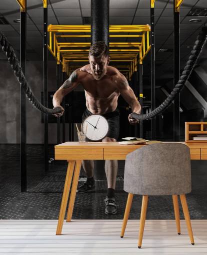 dark gym with man with heavy ropes wallpaper