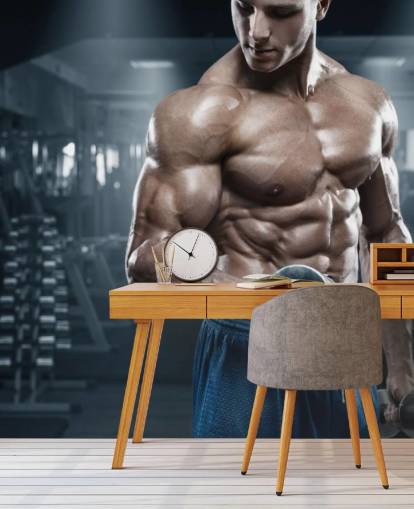 construtor de corpo masculino fazendo pesos no papel de parede do ginásio