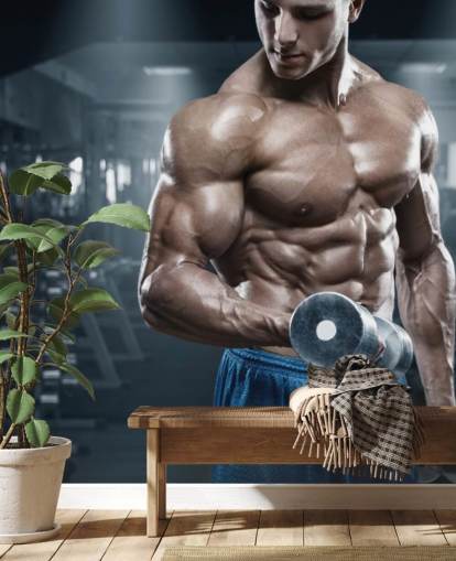 culturista masculino haciendo pesas en el fondo de pantalla de gimnasio