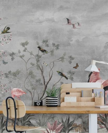 Grå molnig bakgrund med grenar och rosa blommor och flamingo fåglar