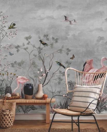 Gray cloudy background with branches and pink flowers and flamingo birds