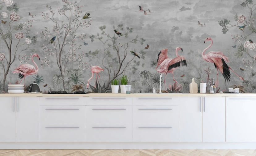 Grey cloudy background with branches and pink flowers and flamingo birds