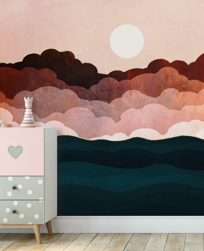 Pink and maroon clouds in a pink sky with a dark blue sea wall mural