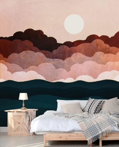 Pink and maroon clouds in a pink sky with a dark blue sea wall mural