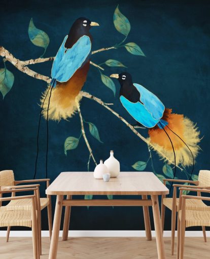 Blue and gold birds on a branch with green leaves on a dark blue background