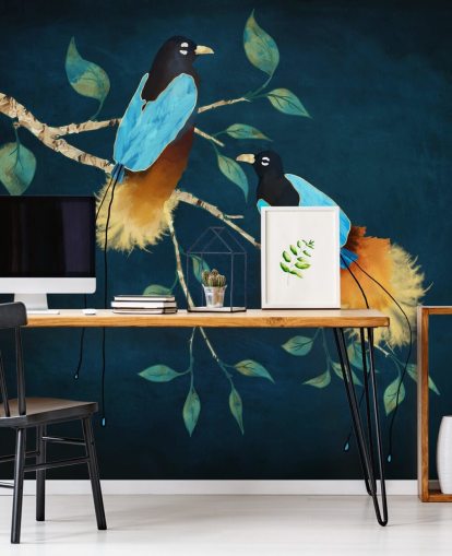 Blue and gold birds on a branch with green leaves on a dark blue background