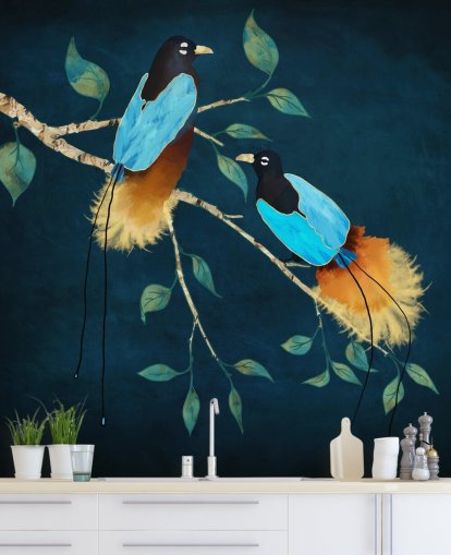 Blue and gold birds on a branch with green leaves on a dark blue background