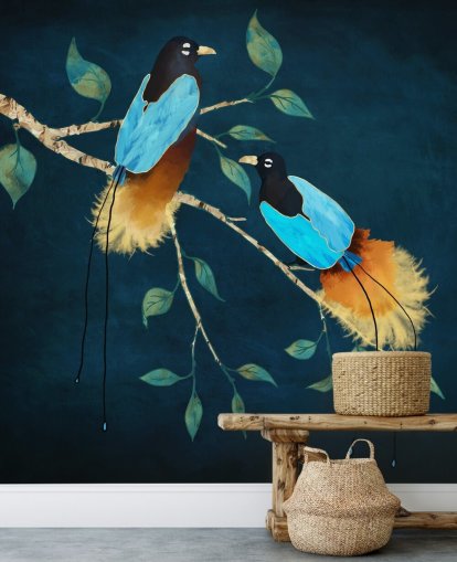 Blue and gold birds on a branch with green leaves on a dark blue background