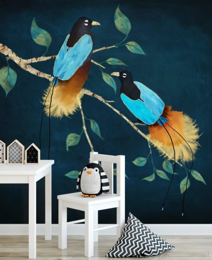 Blue and gold birds on a branch with green leaves on a dark blue background