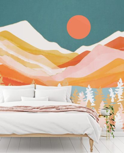 Orange and yellow mountains and forest with a teal sky and orange sun