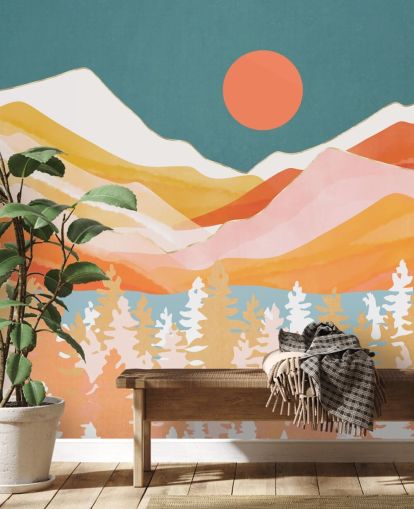 Orange and yellow mountains and forest with a teal sky and orange sun Orange and yellow mountains and forest with a teal sky and orange sun