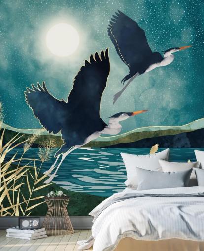 Navy herons flying over a blue river with a turquiose sky