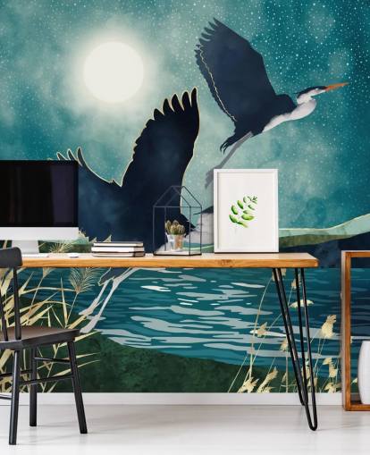 Navy herons flying over a blue river with a turquiose sky