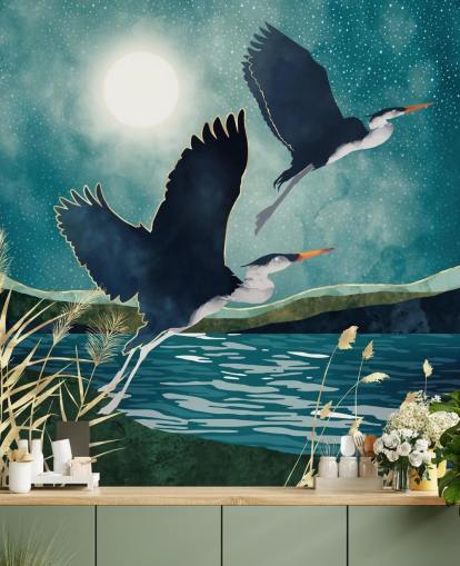 Navy herons flying over a blue river with a turquiose sky