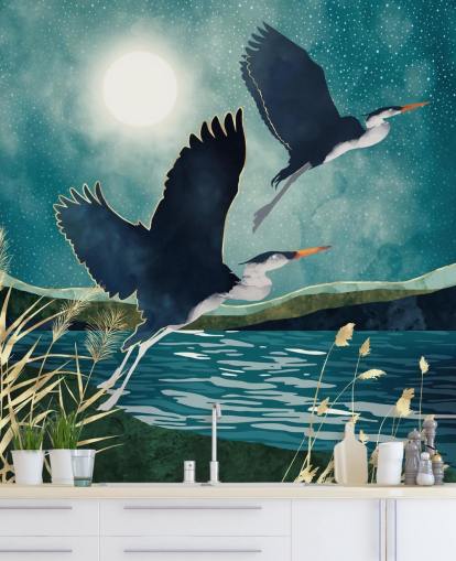 Navy herons flying over a blue river with a turquiose sky