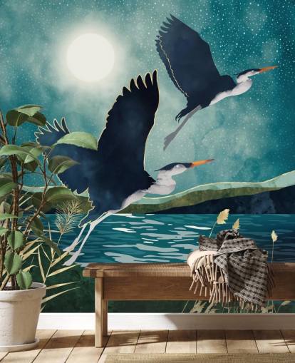 Navy herons flying over a blue river with a turquiose sky