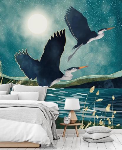 Navy herons flying over a blue river with a turquiose sky