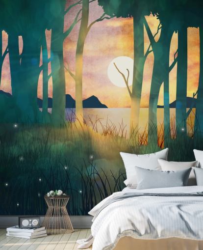 Emerald green forest with a setting sun over a river and blue mountains