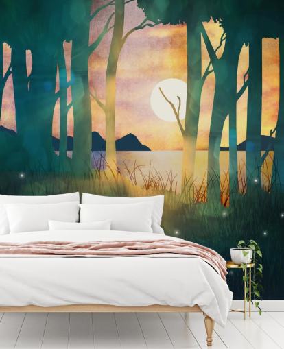 Emerald green forest with a setting sun over a river and blue mountains wallpaper