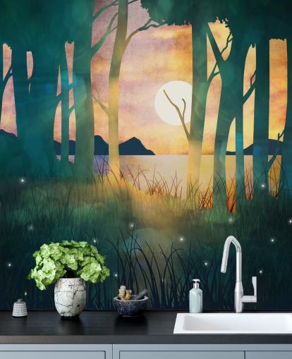 Emerald green forest with a setting sun over a river and blue mountains