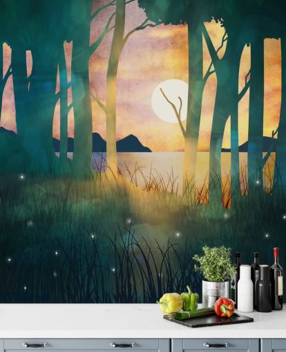 Emerald green forest with a setting sun over a river and blue mountains wallpaper