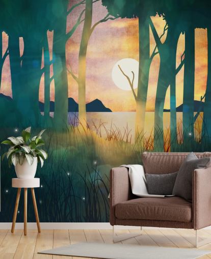 Emerald green forest with a setting sun over a river and blue mountains