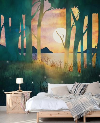 Emerald green forest with a setting sun over a river and blue mountains wallpaper