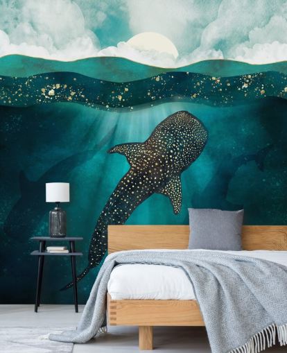 Dark blue ocean with a gold whale shark and distant blue silhouettes 