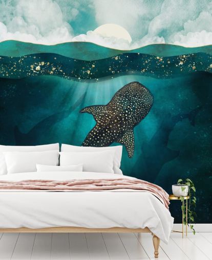 Océano azul oscuro con un tiburón ballena dorado y siluetas azules distantes 