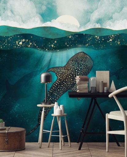 Dark blue ocean with a gold whale shark and distant blue silhouettes wallpaper