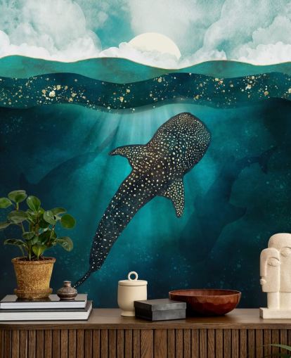 Dark blue ocean with a gold whale shark and distant blue silhouettes 
