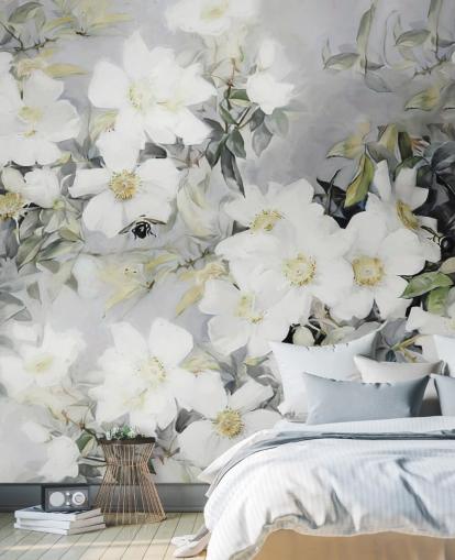 Grey background with white flowers and muted green leaves