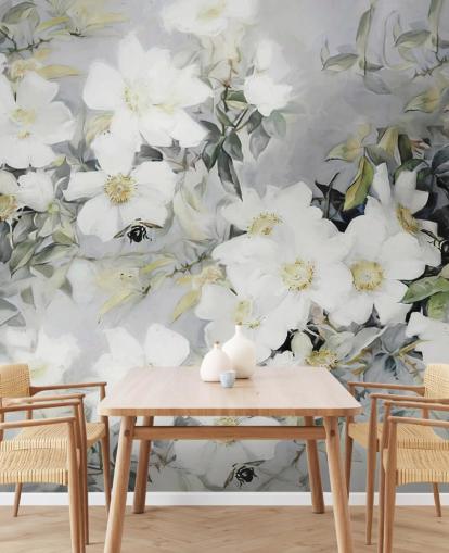 Grey background with white flowers and muted green leaves Grey background with white flowers and muted green leaves