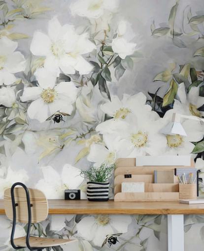 Grey background with white flowers and muted green leaves