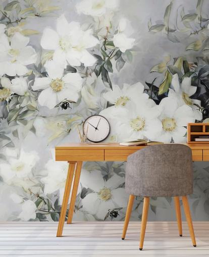 Grey background with white flowers and muted green leaves