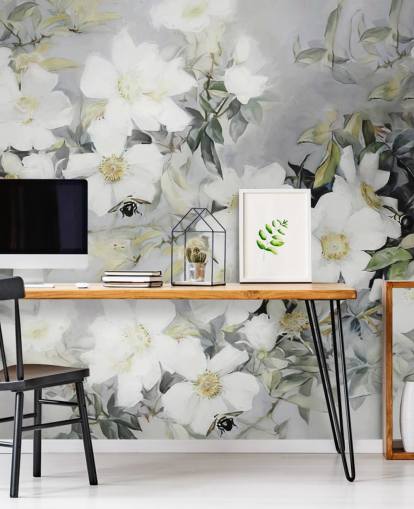 Grey background with white flowers and muted green leaves