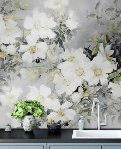 Gray background with white flowers and muted green leaves