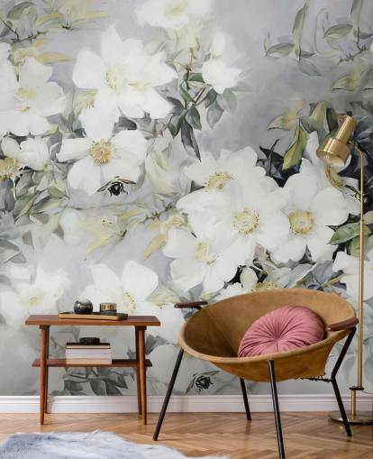 Grey background with white flowers and muted green leaves Grey background with white flowers and muted green leaves